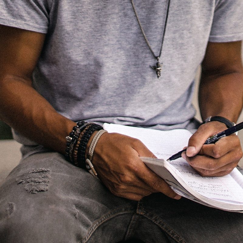 Man writing in a notebook