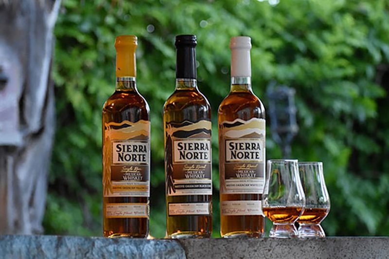 sierra-norte-mexican-whiskey-bottles-with-glasses