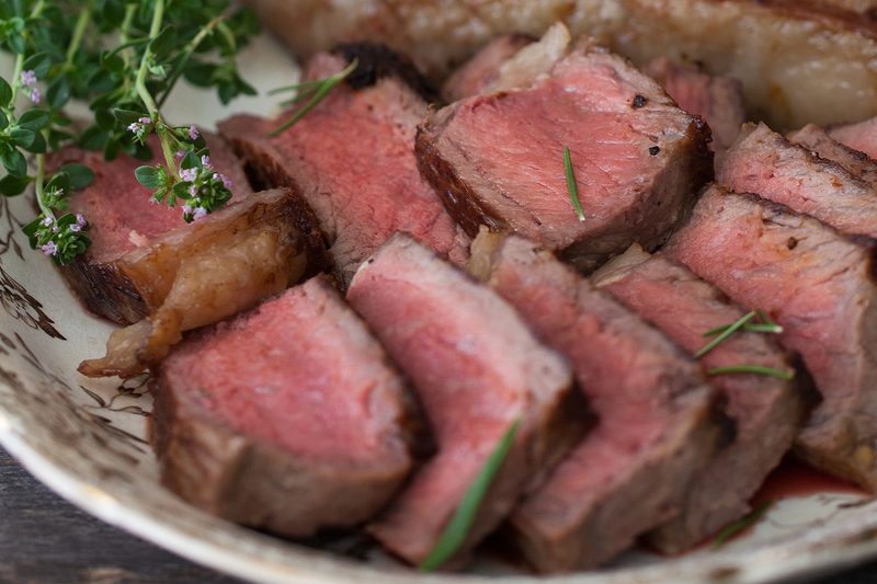 New York strip steak slices on a plate