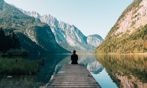 top 7 travel trends to watch for in 2019 follow man sitting on dock