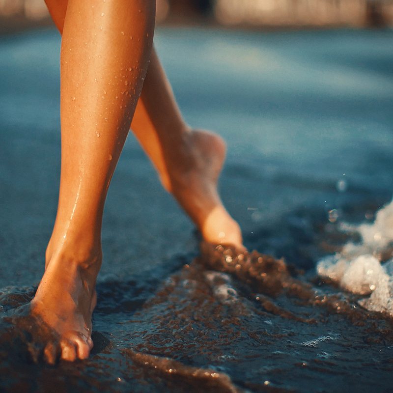 woman feet sand beach ocean