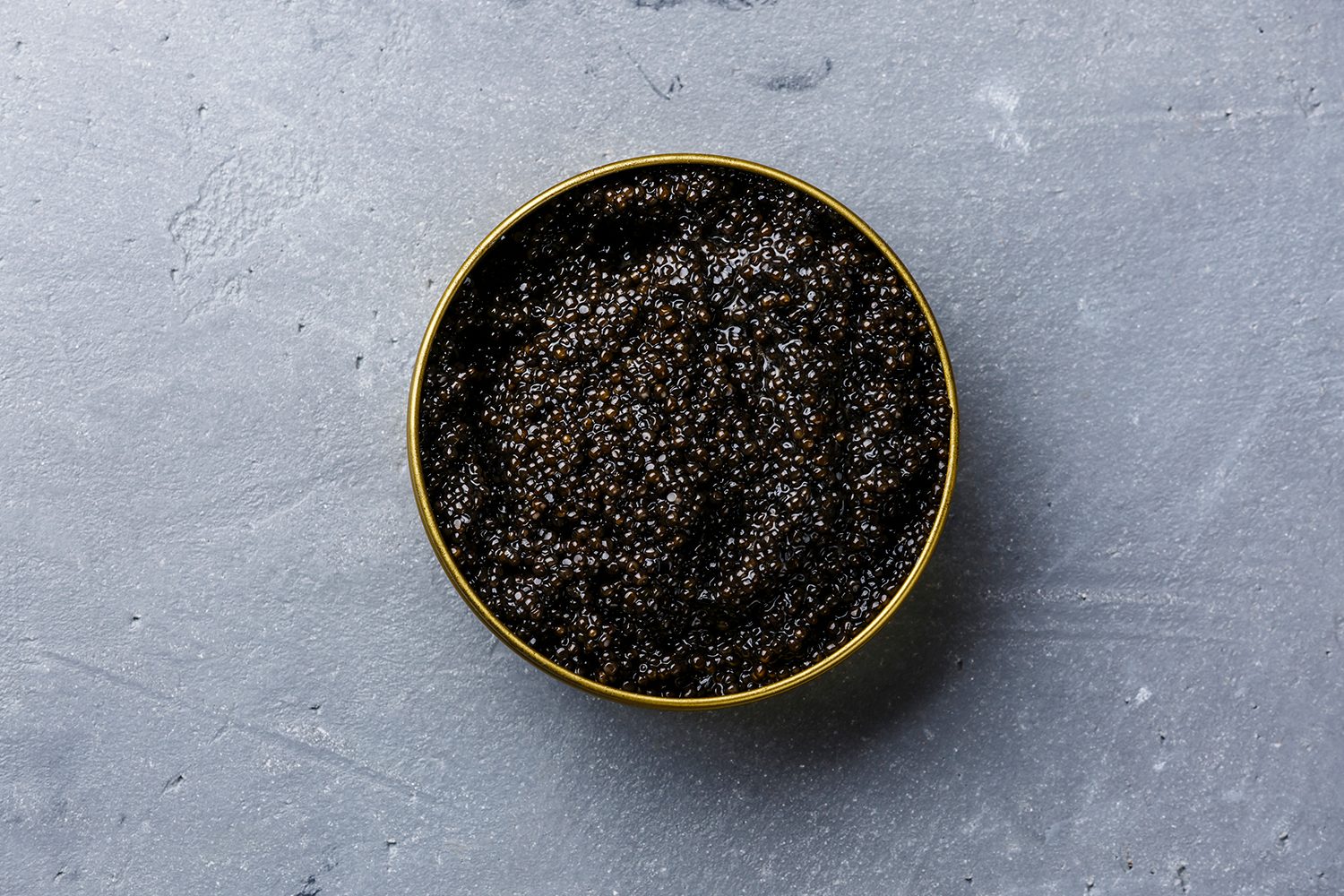 A tin filled of caviar.