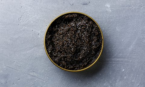 A tin filled of caviar.