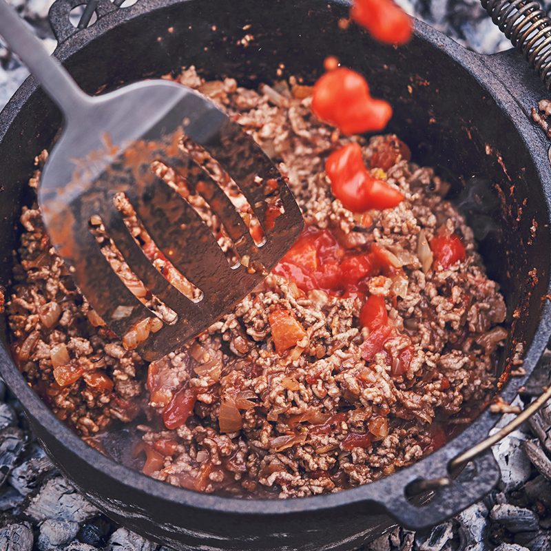 Chili con carne camping fire Dutch oven