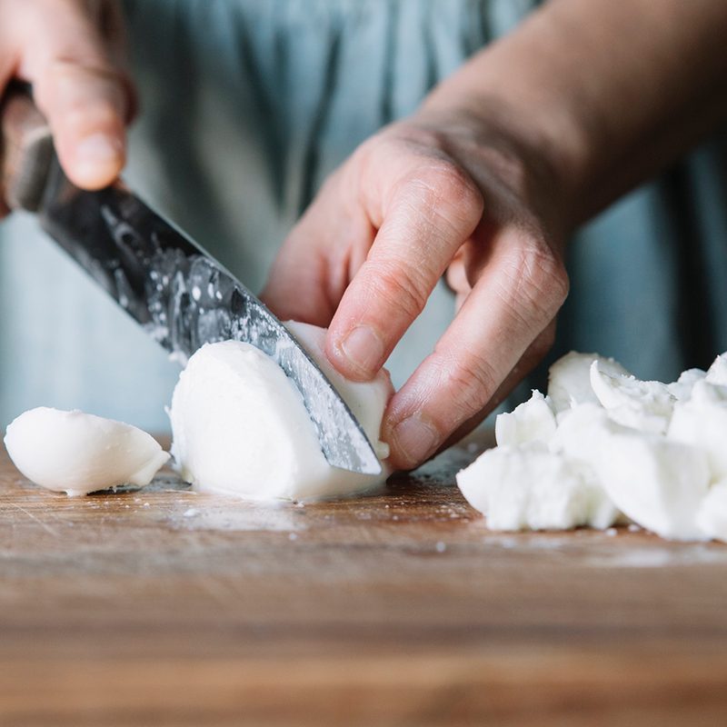 Cutting mozzarella cheese