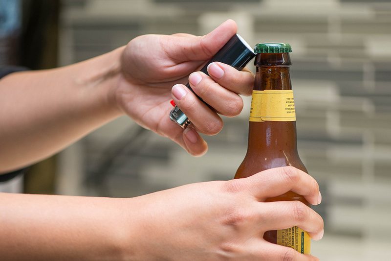 open bottle with lighter