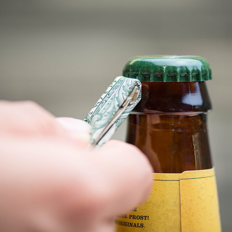 Opening a bottle with money