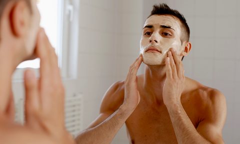 Man putting on a face mask