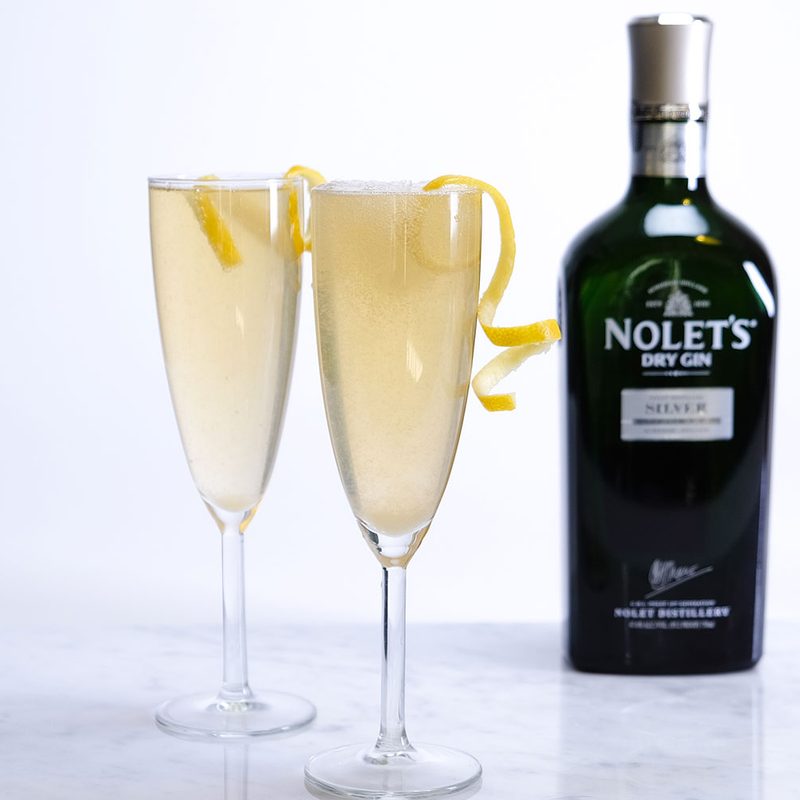 French 75 with a bottle of Nolet's dry gin