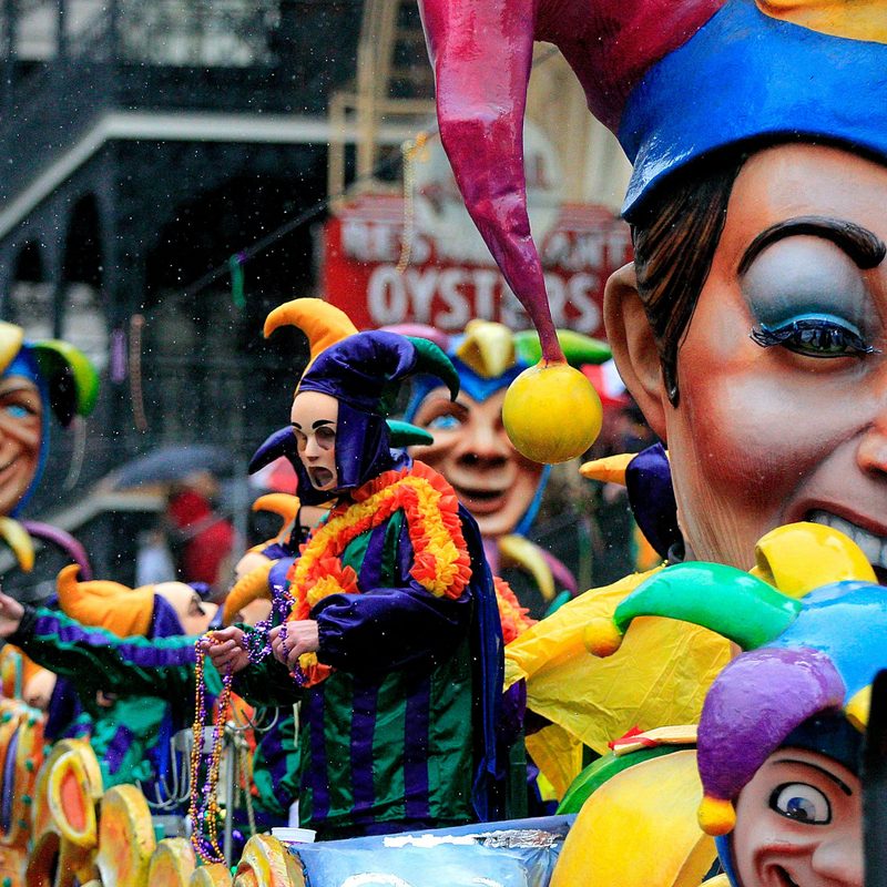 The members of Rex on a float parading on the street.