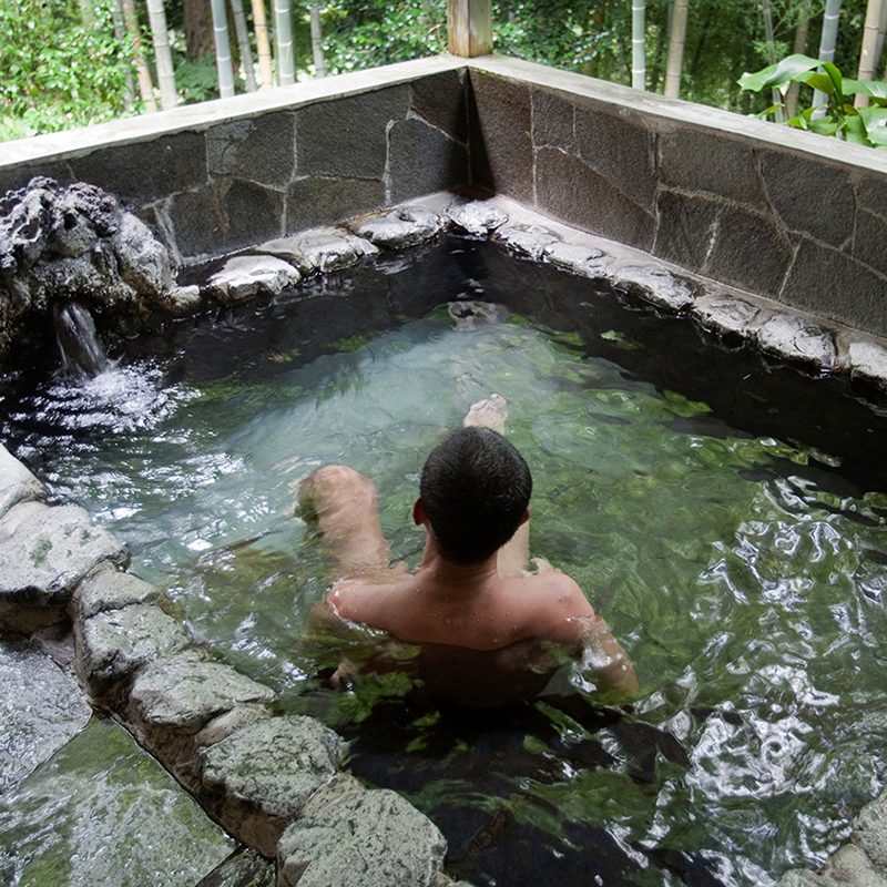 Man relaxing by himself in a Japanese onsen