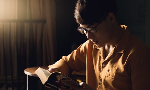 Man reading a book.