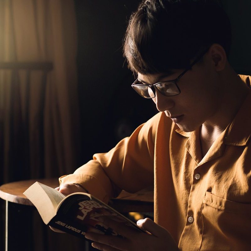 Man reading a book.