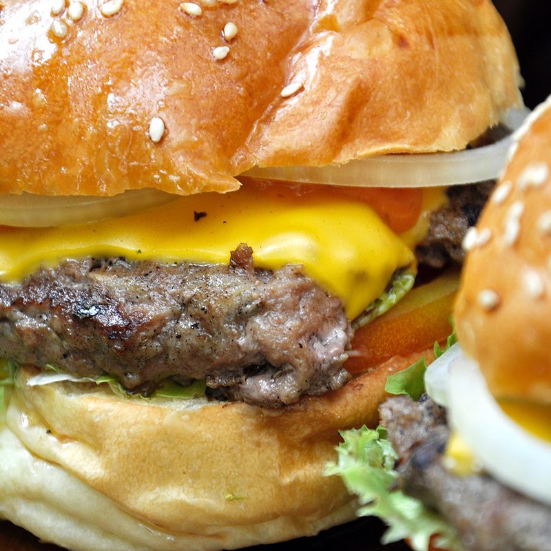 Close-up of two cheeseburgers