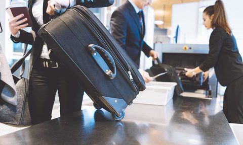 Airport security checking bags.