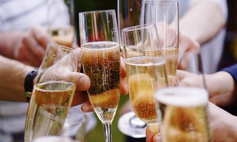 A toast with several glasses of sparkling wine