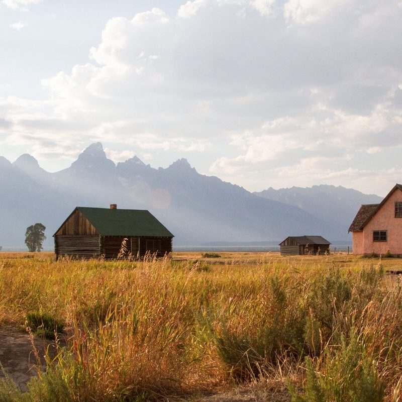A cabin and home amid the scenic backdrop of Grand Teton National Park.