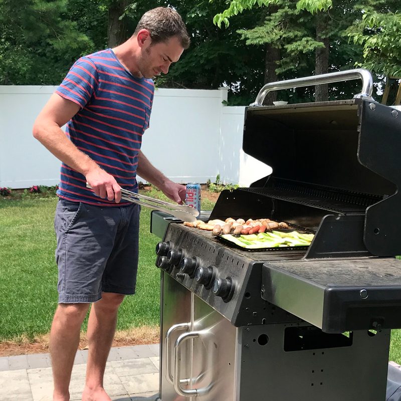Man using an outdoor grill