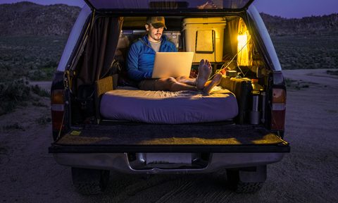 Relaxing in the back of a car on a mattress