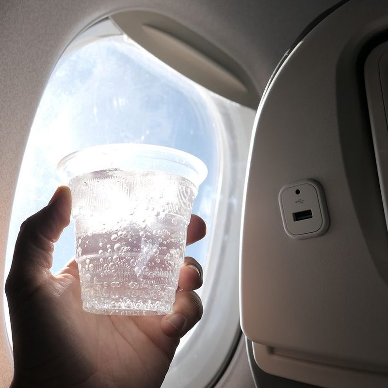 in-flight drink on an airplane