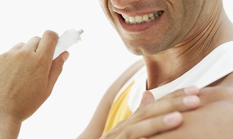 best topical pain relief products man rubbing on lotion