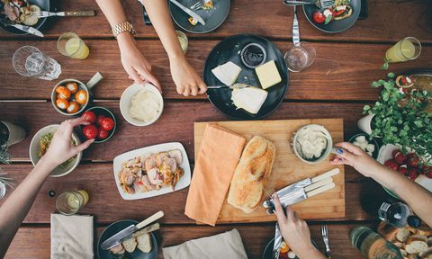 free bread at restaurants on a table being shared with meal getty images