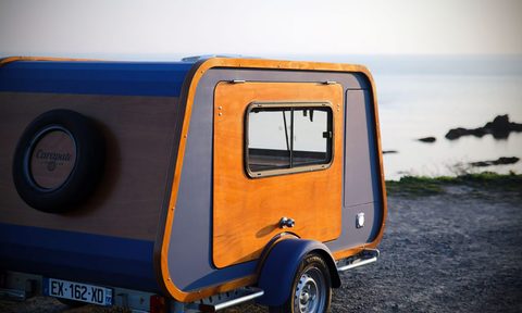 Carapate travel trailer parked on the beach.