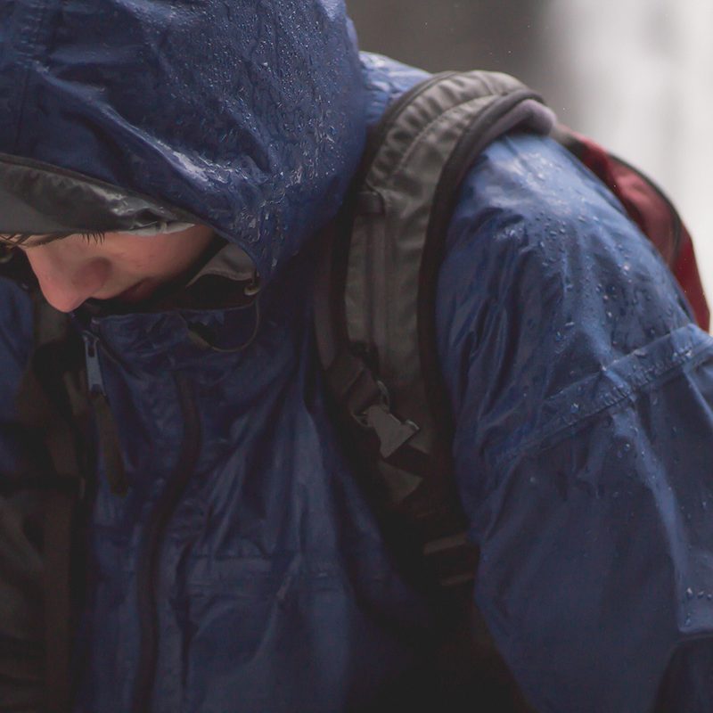 Person in a rain jacket in the rain