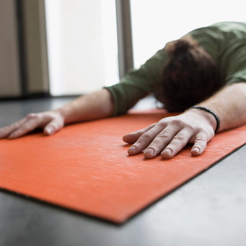 Person doing a frog pose type of stretch.