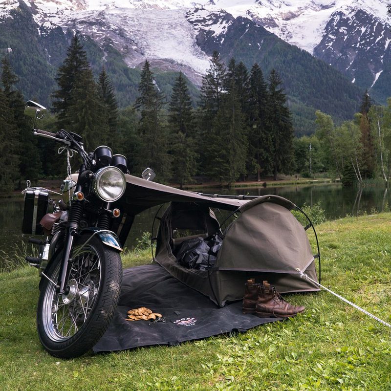 Wingman-of-the-Road Toucan Motorcycle Camping System pitched up by a mountain lake.