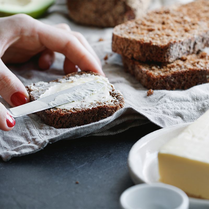 spreading butter on bread