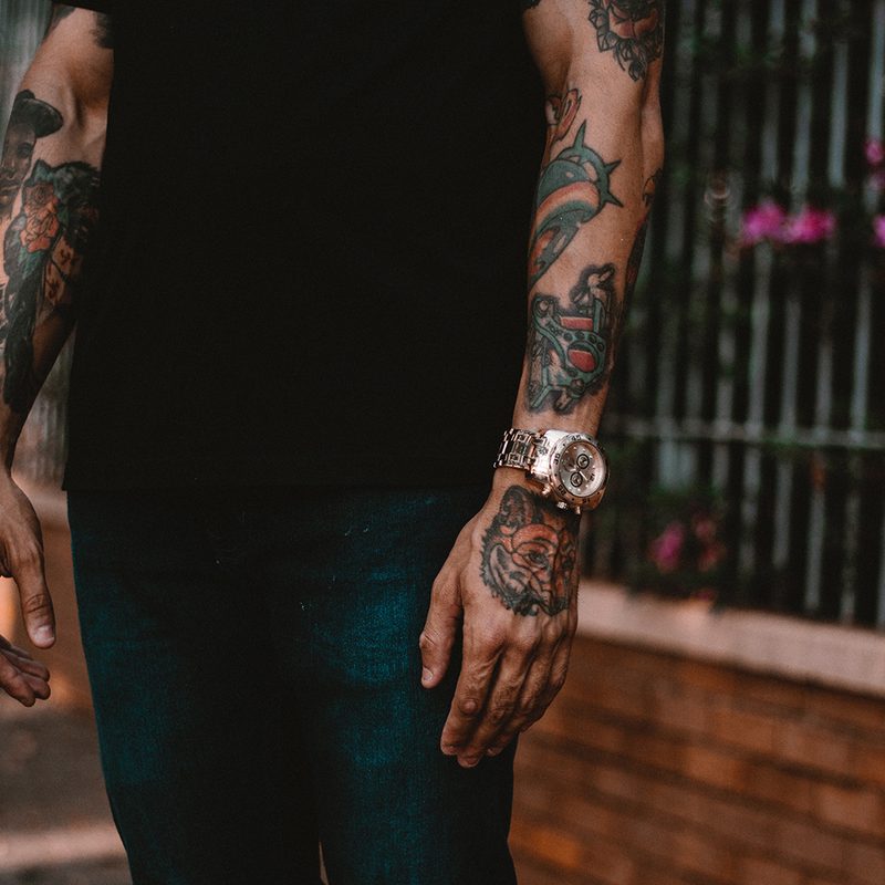 Man with tattooted arms