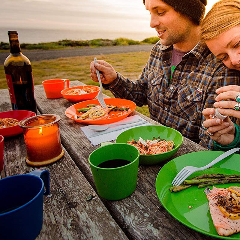 A couple having a meal outside.