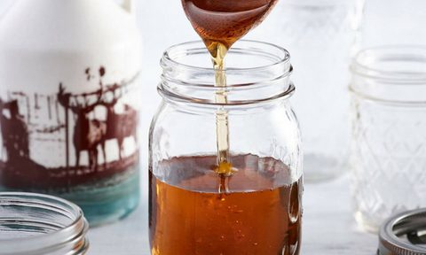 A jar of fresh maple syrup.
