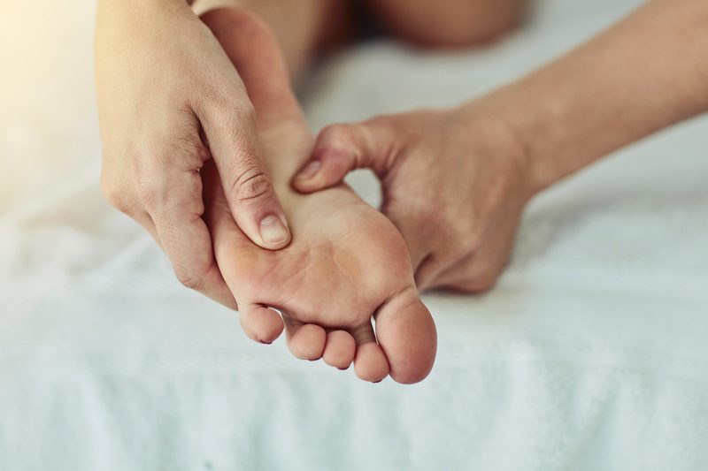 A woman getting a foot rub