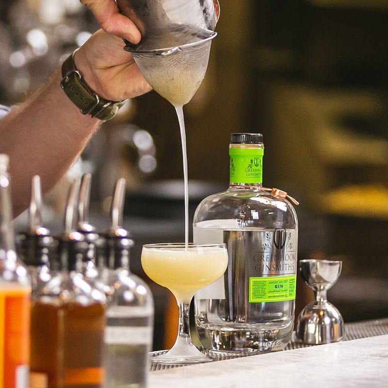 Making a Bee's Knees cocktail