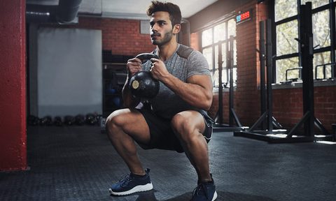 Man doing goblet squats