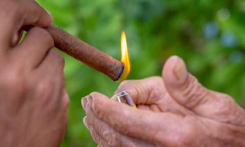 Lighting a cigar