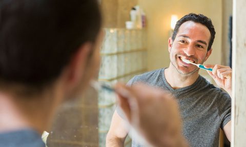 Man brushing teeth