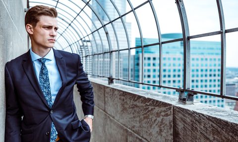 Man wearing navy suit