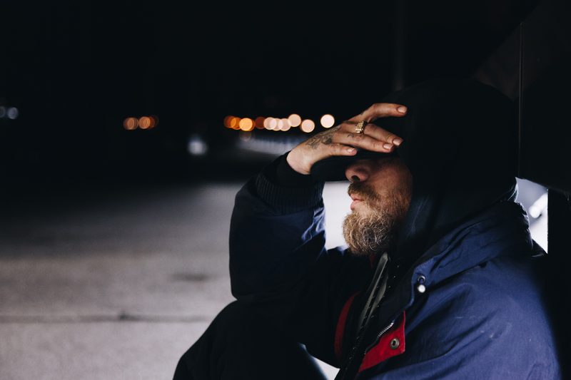 man sitting in the dark.