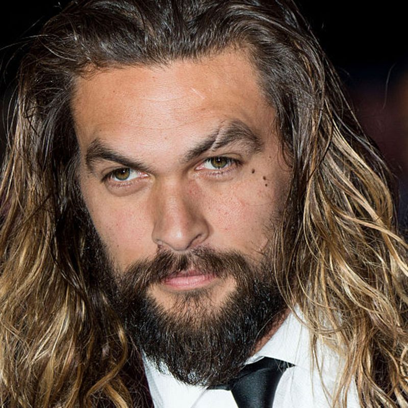 Jason Momoa with long hair with textured waves