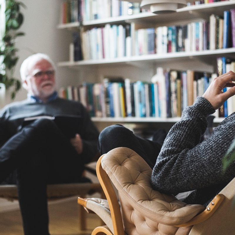 Two men in a therapy session.