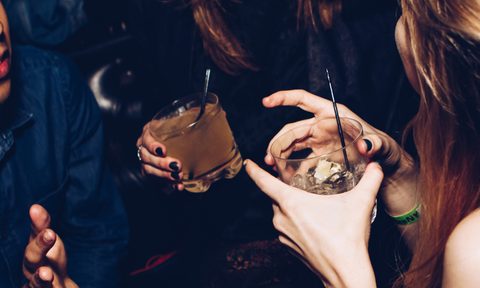 best drink references in music woman drinking cocktails at a club bar unsplash