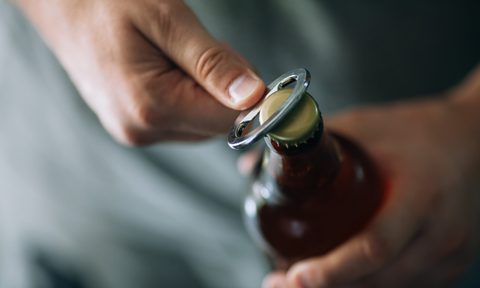best cool bottle openers opening a beer