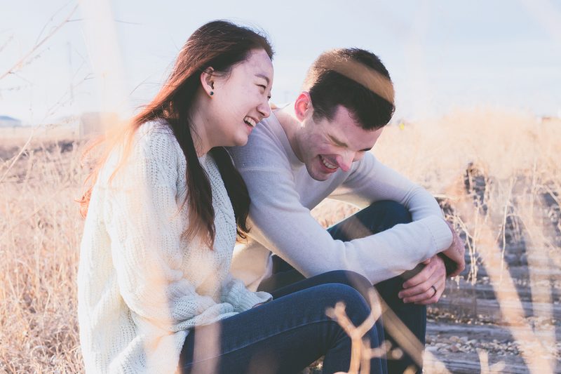 couple laughing beach