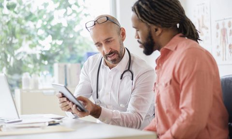 man talking to doctor diagnosis