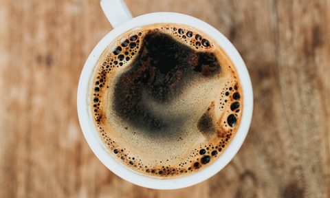 A cup of coffee photographed from above.