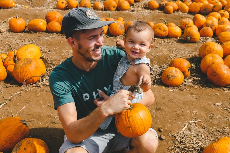 father and child at pumpkinpatch