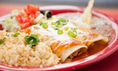 Enchiladas with rice and beans.